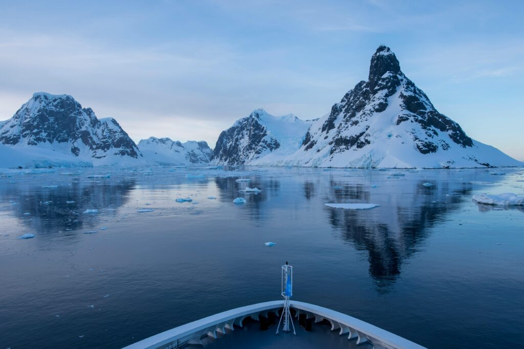 Dramatic landscape of the narrow Lemaire Channel framed by steep mountains.